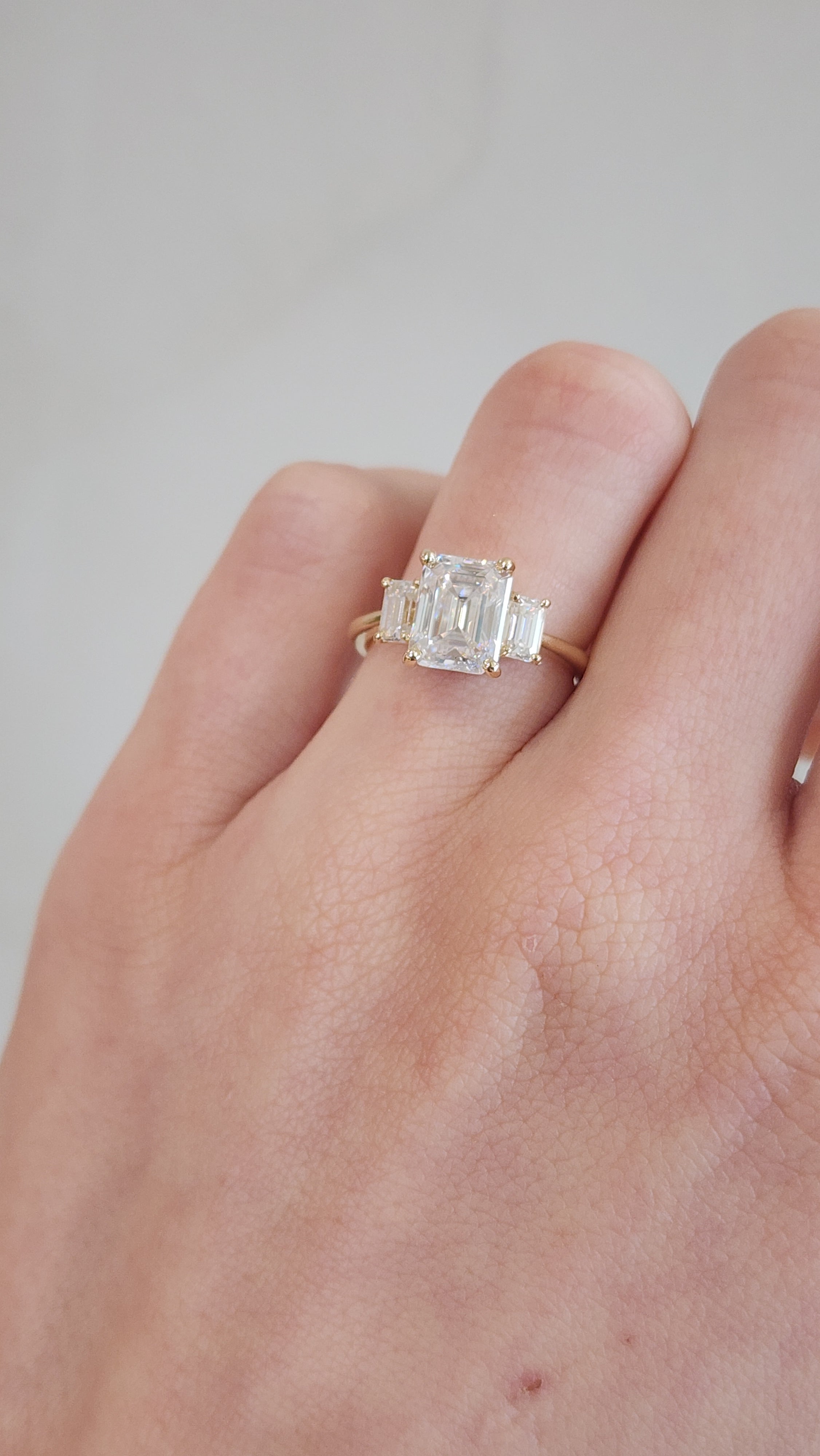 10k Yellow Gold 'Athena' Emerald Cut Moissanite Trilogy Ring